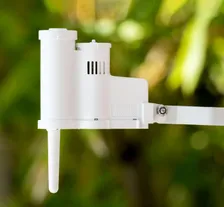 Hunter Rain-Clik Wireless Rain and Freeze Sensor (WRCLIK) — wireless Rain/Freeze shutoff sensor for irrigation controllers, manufacturer photograph taken outdoors on a lawn