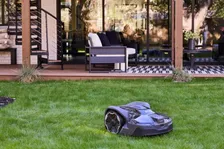 Husqvarna Automower 440 iQ Robotic Mower — wire-free robotic mower, manufacturer photograph taken outdoors on a lawn