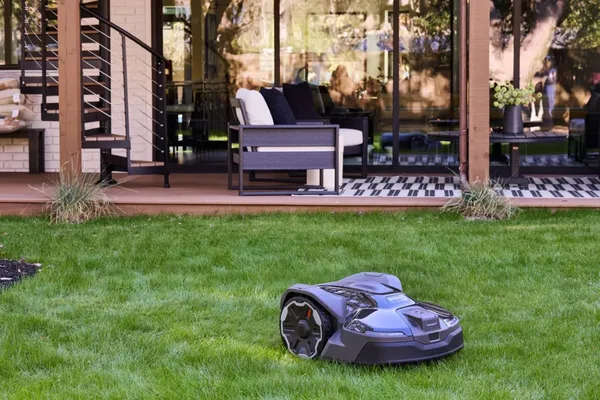 Husqvarna Automower 440 iQ Robotic Mower — wire-free robotic mower, manufacturer photograph taken outdoors on a lawn