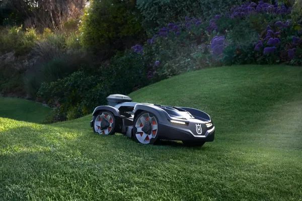 Husqvarna Automower 435 iQ AWD Robotic Mower — wire-free robotic mower, manufacturer photograph taken outdoors on a lawn