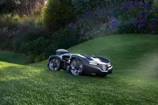 Husqvarna Automower 435 iQ AWD Robotic Mower — wire-free robotic mower, manufacturer photograph taken outdoors on a lawn