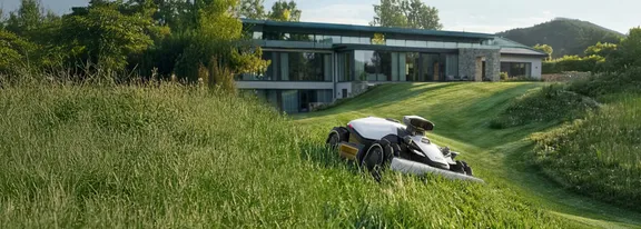 Mammotion LUBA 2 AWD 5000HX Robotic Mower — wire-free robotic mower, manufacturer photograph taken outdoors on a lawn