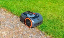 Segway Navimow i110N Robotic Mower — wire-free robotic mower, manufacturer photograph taken outdoors on a lawn